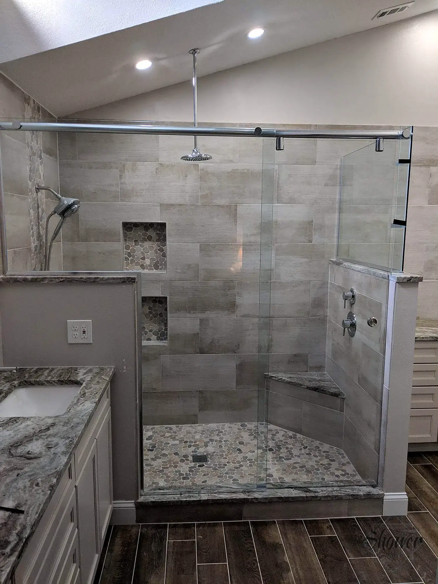 Sliding glass shower doors in a tiled bathroom